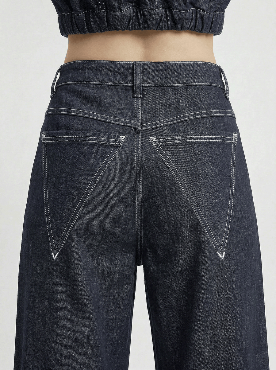 Close back detail of IL DENIM TRIANGOLO by ORNELLA COLICCHIO highlighting the stitching and triangular back pockets